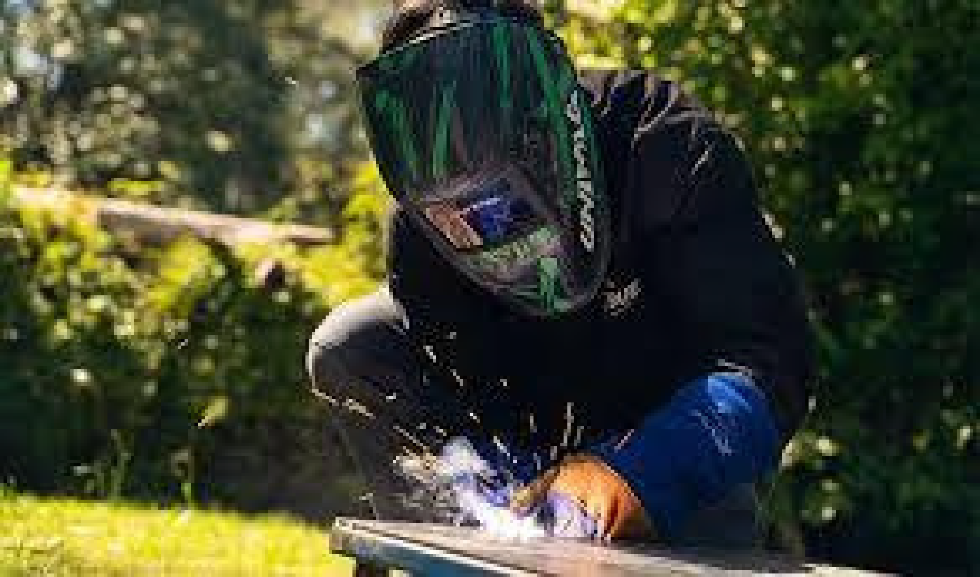 male student welding